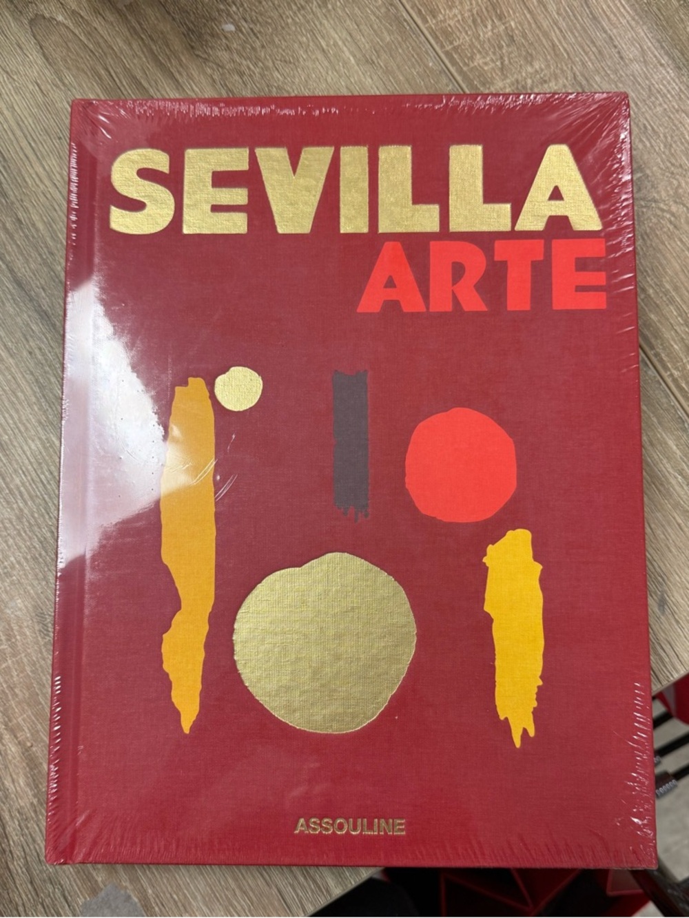 Assouline Sevilla Arte Hardcover - Red with Gold and Orange Accents